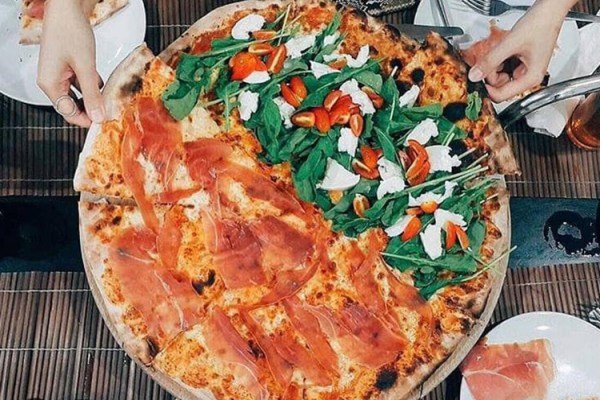 Wood fired pizza at Agli Amici Phuket, caprese and prosciutto crudo
